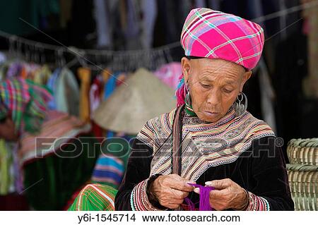 Old woman sorts coloured yarn Bac Ha hilltribe market known for colourful Flower Hmong traders north Vietnam View Large Photo Image Picture - Old woman sorts coloured yarn Bac Ha hilltribe market known for colourful Flower Hmong traders north Vietnam. Fotosearch