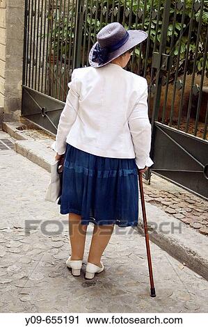 Old woman using a cane, Avignon, departament de Vaucluse, Provenza-Alpes-Costa Azul, France View Large Photo Image Stock Image - Old woman using a cane, Avignon, departament de Vaucluse, Provenza-Alpes-Costa Azul, France. Fotosearch