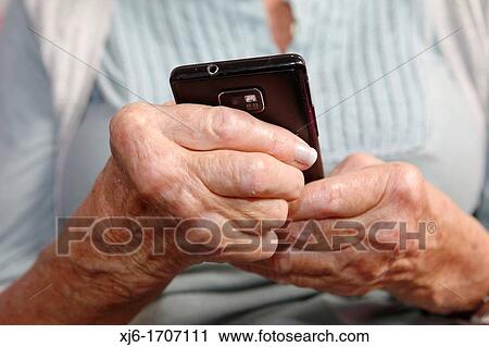 Old woman using smartphone View Large Photo Image Stock Image - Old woman using smartphone. Fotosearch