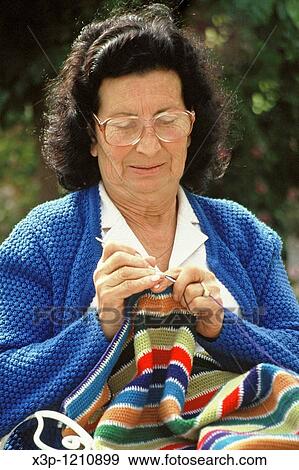 Old woman weaving View Large Photo Image Stock Photo - Old woman weaving. Fotosearch