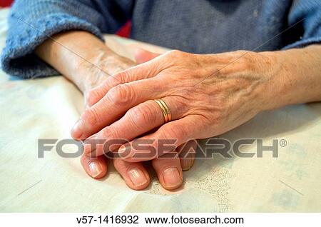 Stock Image - Old woman's hands. Close view.. Fotosearch