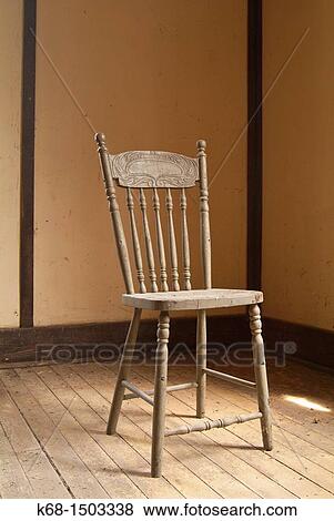 Stock Photo - Old wooden chair in an old house. Fotosearch