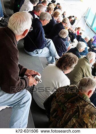 Older crowd watching show View Large Photo Image Stock Photograph - Older crowd watching show. Fotosearch