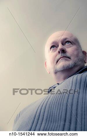 Picture - Older man standing. Fotosearch