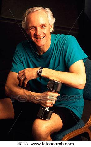 Older man working out with dumbbell View Large Photo Image Stock Photo - Older man working out with dumbbell. Fotosearch