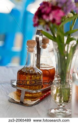 Stock Photo - Olive oil and vinegar bottles, Koufonissi, Cyclades Islands, Greek Islands, Greece, Europe.. Fotosearch