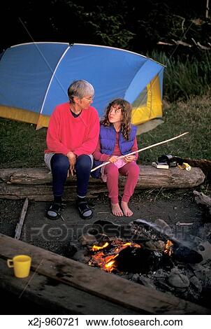 Olympic National Park, Washington - Susan Newell and her nine-year-old daughter Mariel West sit by the fire during a backpacking trip in Olympic National Park MR View Large Photo Image Stock Image - Olympic National Park, Washington - Susan Newell and her nine-year-old daughter Mariel West sit by the fire during a backpacking trip in Olympic National Park MR. Fotosearch