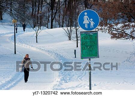 Stock Image - Olympic park in Munich, Germany, under heavy snow with directions to a beer garden where the beer is served ice cold!. Fotosearch