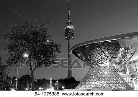 Stock Photo - Olympic Tower and the BMW Welt in the blue hour. Fotosearch