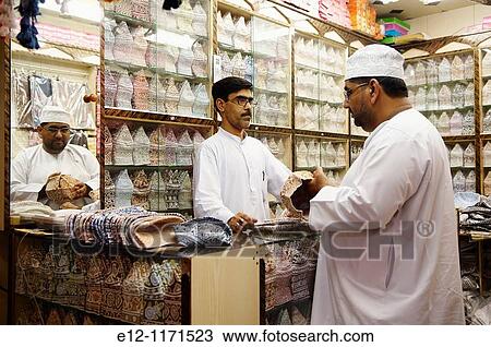 Stock Image - Oman, Sultanat, Middle East, Muscat, Mutrah souk on the area called the Corniche, hat kuma seller.. Fotosearch