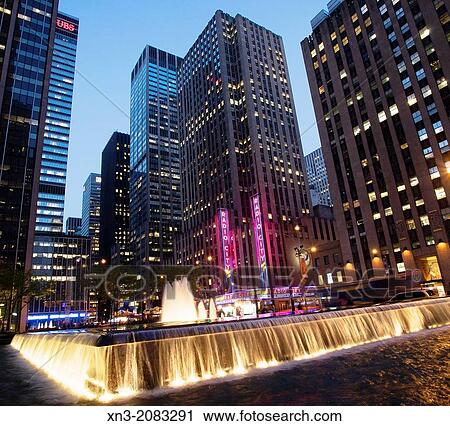 On background Radio City, Music Hall, Rockefeller Center, 6th Avenue, Avenue of the Americas, Midtown, Manhattan, New York City, New York, USA. View Large Photo Image Stock Image - On background Radio City, Music Hall, Rockefeller Center, 6th Avenue, Avenue of the Americas, Midtown, Manhattan, New York City, New York, USA.. Fotosearch
