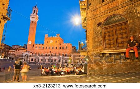 On background Torre del Mangia tower and Palazzo Pubblico town hall, from Costa dei Barbieri, Piazza del Campo, Siena's premier square, Siena, UNESCO World Heritage Site, Tuscany, Italy, Europe. View Large Photo Image Stock Image - On background Torre del Mangia tower and Palazzo Pubblico town hall, from Costa dei Barbieri, Piazza del Campo, Siena's premier square, Siena, UNESCO World Heritage Site, Tuscany, Italy, Europe.. Fotosearch