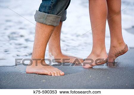 Stock Image - On her toes for a kiss. Fotosearch