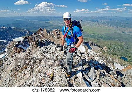 Stock Image - on the summit after climbing The June Couloir on the North Face of Williams Peak high above the Sawtooth Valley in the Sawtooth Mountains near the town of Stanley in central Idaho. Fotosearch