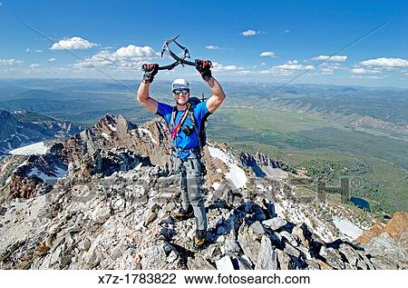 Stock Image - on the summit after climbing The June Couloir on the North Face of Williams Peak high above the Sawtooth Valley in the Sawtooth Mountains near the town of Stanley in central Idaho. Fotosearch