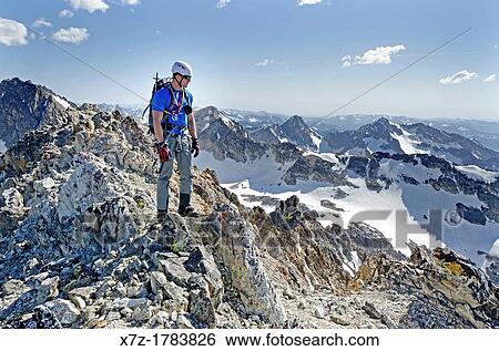 on the summit after climbing The June Couloir on the North Face of Williams Peak high above the Sawtooth Valley in the Sawtooth Mountains near the town of Stanley in central Idaho View Large Photo Image Stock Photograph - on the summit after climbing The June Couloir on the North Face of Williams Peak high above the Sawtooth Valley in the Sawtooth Mountains near the town of Stanley in central Idaho. Fotosearch