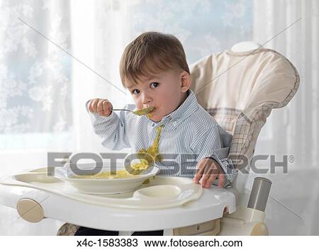 sitting in a high chair