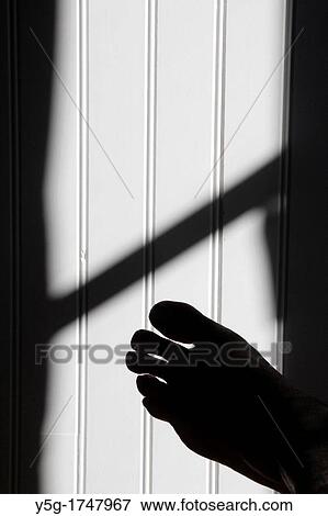 one bare foot in shadow against white wall in room View Large Photo Image Stock Photo - one bare foot in shadow against white wall in room. Fotosearch