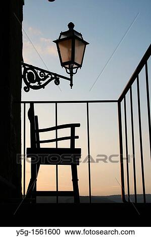 Stock Image - one chair on balcony. Fotosearch