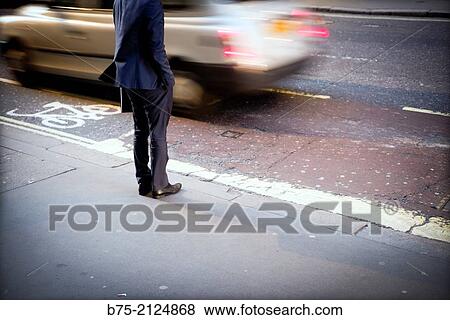 one executive unrecognizable trying to cross the street in London, England, UK, Europe View Large Photo Image Stock Photo - one executive unrecognizable trying to cross the street in London, England, UK, Europe. Fotosearch