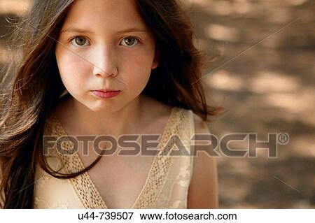 Stock Photo - One girl making funny expression. Fotosearch