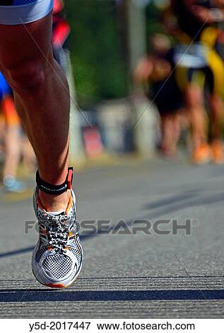 one leg of athlet, running race, 25th International Geneva Triathlon, on July 21, 2013, Geneva, Switzerland. View Large Photo Image Stock Photo - one leg of athlet, running race, 25th International Geneva Triathlon, on July 21, 2013, Geneva, Switzerland.. Fotosearch