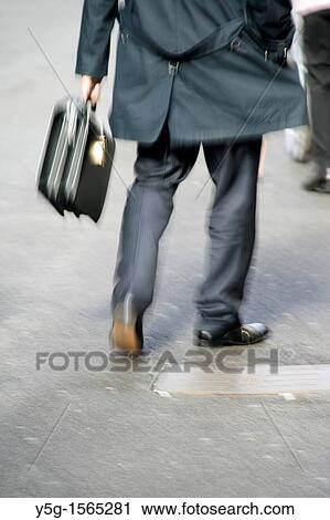 one male commuter carrying briefcase in town in rome italy View Large Photo Image Stock Image - one male commuter carrying briefcase in town in rome italy. Fotosearch