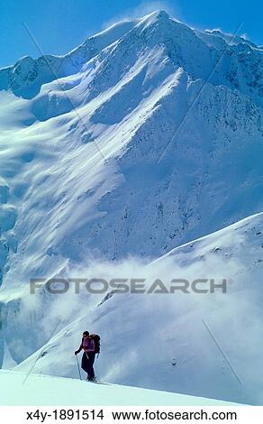 Picture - One man on ski walking uphill in remote part of Otztal Alps, Austria. Fotosearch