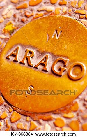 Picture - One of the Arago medallions placed along the zero meridian line of Paris near the Palais-Royal in honor of astronomist Fran? ois Arago, who first established the meridian. Paris. France. Fotosearch