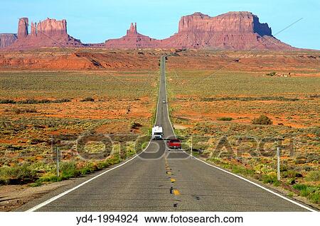 One of the most famous images of the Monument Valley is the long straight road (US 163)leading across flat desert towards sandstone buttes and pinnacles rock. Monument Valley Tribal Park, Nabajo Nation, Arizona/Utah, USA. View Large Photo Image Picture - One of the most famous images of the Monument Valley is the long straight road (US 163)leading across flat desert towards sandstone buttes and pinnacles rock. Monument Valley Tribal Park, Nabajo Nation, Arizona/Utah, USA.. Fotosearch