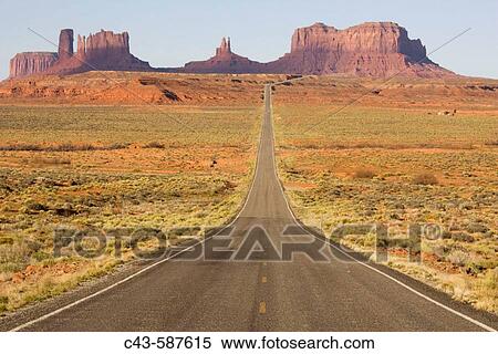 One of the most famous images of the Monument Valley is the long straight road (US 163) leading across flat desert towards sandstone buttes and pinnacles of rock. Monument Valley Tribal Park, Navajo Nation, Arizona/Utah, USA. View Large Photo Image Stock Photography - One of the most famous images of the Monument Valley is the long straight road (US 163) leading across flat desert towards sandstone buttes and pinnacles of rock. Monument Valley Tribal Park, Navajo Nation, Arizona/Utah, USA.. Fotosearch