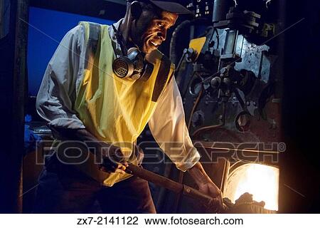 One of the railway workers of the Livingstone Express luxury train charcoal powered train locomotive. View Large Photo Image Stock Image - One of the railway workers of the Livingstone Express luxury train charcoal powered train locomotive.. Fotosearch