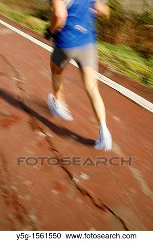one runner on footpath in park View Large Photo Image Stock Image - one runner on footpath in park. Fotosearch
