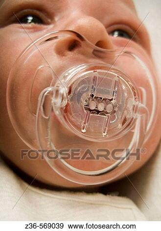 One week old girl with soother View Large Photo Image Stock Photo - One week old girl with soother. Fotosearch