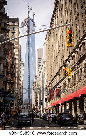 One World Trade Center in Lower Manhattan in New York is seen from Fulton Street. The final antenna installation is being put on hold for better weather but when finished the building will be 1, 776 feet, the third tallest building in the world. View Large Photo Image Stock Photograph - One World Trade Center in Lower Manhattan in New York is seen from Fulton Street. The final antenna installation is being put on hold for better weather but when finished the building will be 1, 776 feet, the third tallest building in the world.. Fotosearch
