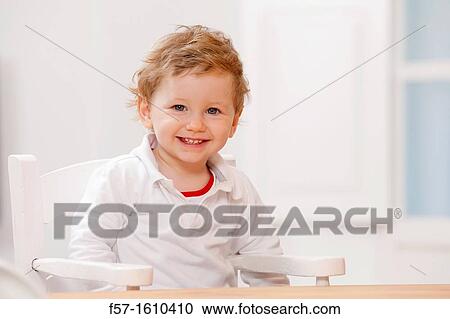 One year old boy in a high chair View Large Photo Image Stock Image - One year old boy in a high chair. Fotosearch