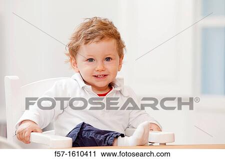 One year old boy in a high chair View Large Photo Image Stock Image - One year old boy in a high chair. Fotosearch