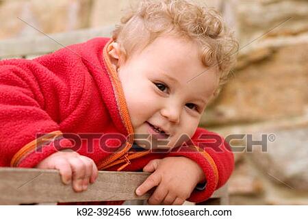 One year old boy on a deck chair View Large Photo Image Stock Photograph - One year old boy on a deck chair. Fotosearch
