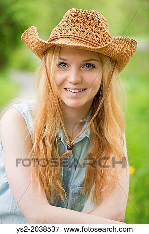One young attractive blonde woman with cowboy hat. View Large Photo Image Stock Photo - One young attractive blonde woman with cowboy hat.. Fotosearch