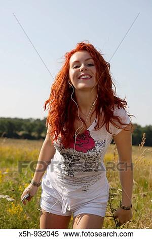 one young woman listen to the music View Large Photo Image Stock Photography - one young woman listen to the music. Fotosearch