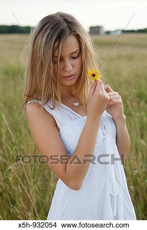 one young woman with flower View Large Photo Image Picture - one young woman with flower. Fotosearch