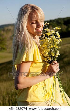 one young woman with flowers View Large Photo Image Picture - one young woman with flowers. Fotosearch