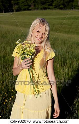 one young woman with flowers View Large Photo Image Stock Image - one young woman with flowers. Fotosearch