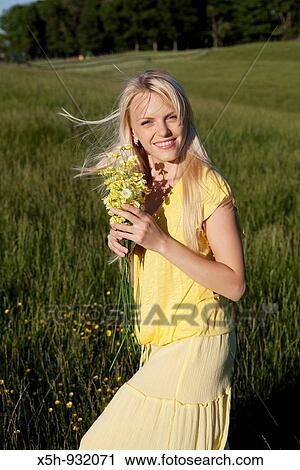 one young woman with flowers View Large Photo Image Stock Image - one young woman with flowers. Fotosearch