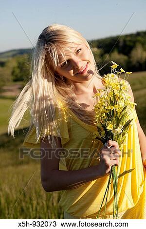 one young woman with flowers View Large Photo Image Stock Image - one young woman with flowers. Fotosearch