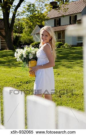 one young woman with flowers View Large Photo Image Stock Photography - one young woman with flowers. Fotosearch