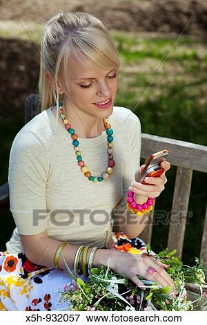 one young woman with phone View Large Photo Image Stock Photo - one young woman with phone. Fotosearch