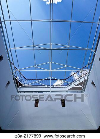 Stock Photo - Open ceiling with bright blue sky in Cafe Clock in Marrakech, Morocco.. Fotosearch