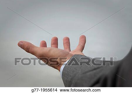 Picture - Open hand of a businessman, Miami, USA. Fotosearch