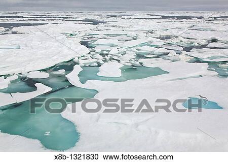 Stock Image - Open leads surrounded by multi-year ice floes in the Barents Sea between Edgeoya Edge Island and Kong Karls Land in the Svalbard Archipelago, Norway. Fotosearch